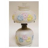 1006	MINIATURE ANTIQUE KEROSENE LAMP W/EMBOSSED MULTICOLOR FLORAL DESIGN, APPROXIMATELY 9 IN HIGH