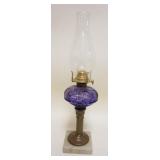 1007	KEROSENE LAMP W/FLUTED BRASS COLUMN, AMYTHEST FONT ON MARBLE BASE, APPROXIMATELY 17 1/2 IN HIGH