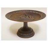 1024	BRONZE TAZZA W/EMBOSSED CHERUBS AT TOP, APPROXIMATELY 8 IN X 4 1/4 IN HIGH