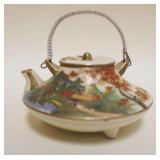 1029	SMALL SATSUMA TEAPOT, APPROXIMATELY 2 1/4 IN