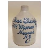 1072	BLUE SCRIPT DECORATED STONEWARE JUG, CHAS STEIGLER NEWARK NJ, APPROXIMATELY 9 IN HIGH
