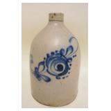 1075	STONEWARE BLUE DECORATED JUG, CRACK AT BASE, APPROXIMATELY 11 3/4 IN HIGH
