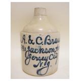 1077	STONEWARE JUG A&C BRAUER JERSEY CITY NJ, APPROXIMATELY 9 1/2 IN HIGH