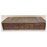 1111	SMALL TABLE TOP COUNRY CABINET, 8 DRAWER, APPROXIMATELY 8 1/2 IN X 19 1/2 IN X 4 1/2 IN HIGH