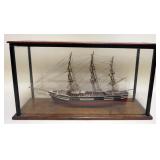 1129	WOOD SHIPS MODEL UNDER GLASS, APPROXIMATELY 7 1/2 IN X 23 IN X 13 IN HIGH