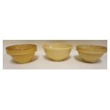 1152	LOT OF 3 EMBOSSED YELLOWARE MIXING BOWLS, LARGEST APPROXIMATELY 10 IN X 5 IN HIGH
