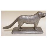 1166	ALUMINUM DOG NUTCRACKER, APPROXIMATELY 12 IN X 3 IN X 6 IN