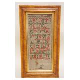 1169	ANTIQUE SAMPLER IN BIRDSEYE MAPLE FRAME, WEAR TO SAMPLER, APPROXIMATELY 6 1/2 IN X 12 IN OVERAL