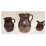 1213	LOT OF 3 BROWN GLAZED STONEWARE BATTER & CREAM PITCHERS, TALLEST APPROXIMATELY 11 IN HIGH