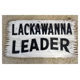 1232	DOUBLE SIDED WOOD SIGN *LACKAWANA LEADER*, APPROXIMATELY 19 IN X 37 IN