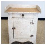 1248	SMALL STAND W/ONE DRAWER & ONE DOOR IN PAINT DETRESSED FINISH, APPROMATEY 17 IN X 28 IN X 34 IN