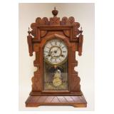 1299	ANTIQUE WALNUT GINGERBREAD KITCHEN CLOCK, APPROXIMATELY 23 IN HIGH