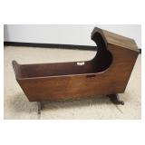 1295A	ANTIQUE WALNUT HOODED CRADLE W/FINE DOVETAILING, LOSS TO ONE SIDE OF ROCKER, APROXIMATELY 26 I