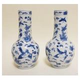 1038	PAIR OF ASIAN BLUE & WHITE VASES W/IMAGES OF BIRDS, FLOWERS, & INSECTS, EACH HAVING CHARACTER M