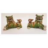 1042	PAIR OF ASIAN POTTERY FOO DOGS, EACH APPROXIMATELY 4 IN X 8 IN X 5 IN HIGH