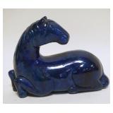 1054	ASIAN POTTERY BLUE GLAZED FIGURE OF A HORSE, APPROXIMATELY 8 IN X 3 IN X 6 IN