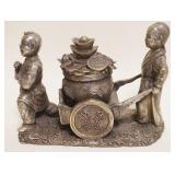 1062	METAL FIGURE OF *WEALTH BOY*, APPROXIMATELY 9 IN X 4 IN X 6 1/2 IN HIGH