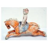1197	CHINESE POLYCHROME DECORATED POTTERY FIGURE OF MAN RIDING HORSE, APPROXIMATELY 11 IN X 3 IN X 7