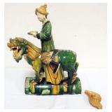1203	CHINESE LARGE GLAZED TERRACOTTA FIGURE OF MAN RIDING ON THE BACK OF AN ANIMAL, APPROXIMATELY 14