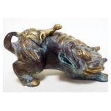 1221	CHINESE BRONZE FOO DOG CARRYING FERRIT ON HIS BACK, APPROXIMATELY 7 IN X 4 IN X 3 IN H