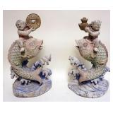 1236	PAIR OF POLYCHROME CARVED WOOD CHINESE FIGURES OF MEN RIDING ON TOP OF FISH, EACH APPROXIMATELY