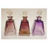 1005	AMETHYST TO CLEAR PYRAMID SHAPED TOILETRY BOTTLES W/ENGRAVED EYE LOTION, FACE LOTION & LISTERIN