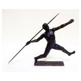 1064	CAST BRONZE IMAGE OF MAN THROWING JAVELIN, APPROXIMATELY 2 IN X 18 IN X 10 IN HIGH, SIGNED KELS
