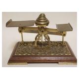 1071	ANTIQUE BRASS LETTER SCALE W/WEIGHTS MOUNTED ON WALNUT BASE, APPROXIMATELY 8 1/2 IN X 6 IN X 6 
