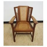1225	MISSION OAK SIGNED LIMBERT ARM CHAIR, LOSS TO CANE