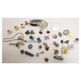 1243	GROUP OF ASSORTED COSTUME JEWELRY INCLUDING CUFF LINKS, PINS, MENS WATCH, ETC.