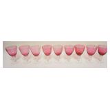 1057	9 CRANBERRY TO CLEAR GOBLETS, APPROXIMATELY 6 1/4 IN HIGH