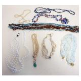 1180	9 ASSORTED BEADED AND PEARL NECKLACES
