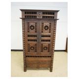 1224	ENGLISH OAK BRENTON CABINET, CARVED 2 DOOR OVER 1 DRAWER WITH CARVED WAGON WHEEL AND SPINDLES, 
