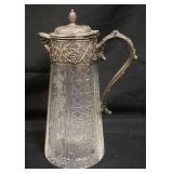 1044	ANTIQUE CUT & ETCHED GLASS ICEWATER PITCHER W/SILVERPLATE TOP, HINGE ON LIDS NEEDS TO BE REATTA