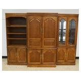 1150	BASSETT CONTEMPORARY OAK 3 SECTION WALL UNIT WITH MIRROR BACK AND INTERIOR LIGHTS