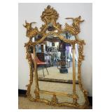 1181	FRIEDMAN BROTHERS GILTWOOD MIRROR WITH CARVED FLOWERS AND BIRD ON CREST, APPROXIMATELY 39 IN X 