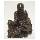 1013	ASIAN WOOD CARVING OF A MAN READING & PETTING A TIGER, APPROXIMATELY 8 IN HIGH