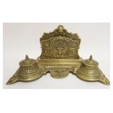 1096	ORNATE BRASS LETTER HOLDER W/DOUBLE INKWELLS & PEN HOLDER TRAY, EMBOSSED CHERUB HEAD AT CREST, 