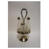 1098	ANTIQUE CASTER SET IN SILVERPLATE HOLDER W/5 WHEEL CUT BOTTLES, APROXIMATELY 14 1/4 IN HIGH
