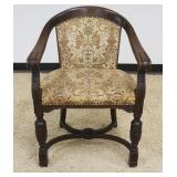 1105	CARVED OAK UPHOLSTERED BARREL BACK CHAIR