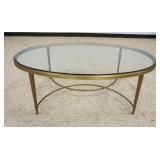 1110	ITALIAN OVAL BRASS GLASS TOP COCKTAIL/COFFEE TABLE, APPROXIMATELY 48 IN X 31 IN X 17 IN HIGH