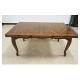 1157	WALNUT FRENCH PROVINCIAL DINING TABLE W/PULL OUT SURFACE LEAVES, APPROXIMATELY CLOSED 66 IN X 4