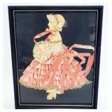1228	RIBBON ART FRAMED DOLL, APPROXIMATELY 9 IN X 11 IN OVERALL