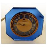 1251	VINTAGE BLUE MIRROR DECO TELECHRON ELECTRIC CLOCK, APPROXIMATELY 5 IN X 5 IN