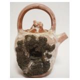 1037	ASIAN TERRACOTTA POTTERY TEAPOT W/EMBOSSED IMAGE OF MAN ON BALCONY W/INCISED CHARACTER MARKS ON