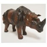 1038	LEATHER RHINOCEROS W/GLASS EYES, APPROXIMATELY 14 IN X 5 IN X 8 1/4 IN HIGH