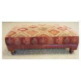 1122	ROCHE BOBOIS OTTOMAN W/LEATHER BASE TRIM & BRASS TACK ACCENTS, APPROXIMATELY 26 IN X 50 IN X 16