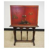1135	ASIAN 2 DOOR LACQUERED CABINET W/RELIEF IMAGES OF PEOPLE, TEMPLES & BIRDS, APPROXIMATELY 27 IN 