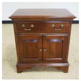 1149	SOLID CHERRY ONE DRAWER 2 DOOR STAND BY THE SUMPTER CABINET CO, APPROXIMATELY 26 IN X 17 IN X 2