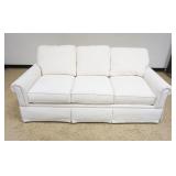 1159	BASSET IVORY UPHOLSTERED SOFA, APPROXIMATELY 80 IN X 38 IN X 30 IN HIGH